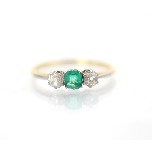 161 - An early 20th century emerald and diamond three stone ring, the central square cut emerald with an o... 