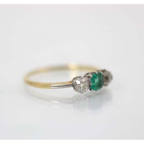 161 - An early 20th century emerald and diamond three stone ring, the central square cut emerald with an o... 