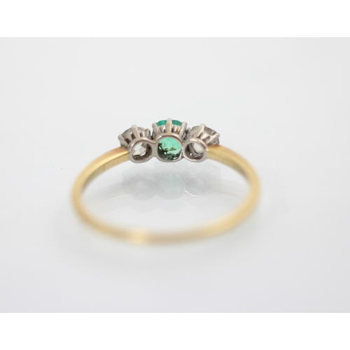 161 - An early 20th century emerald and diamond three stone ring, the central square cut emerald with an o... 