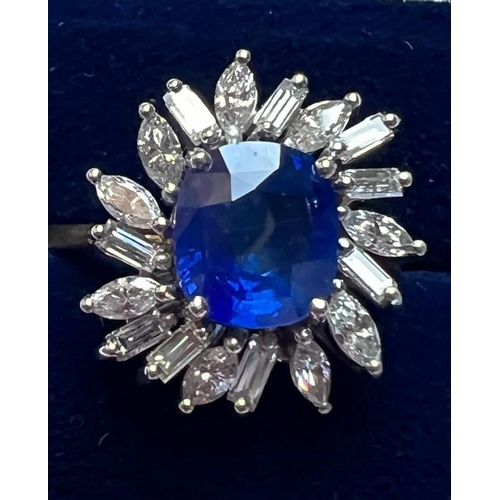 169 - A 1960's sapphire and diamond cluster ring, the central cushion cut sapphire within white metal claw... 