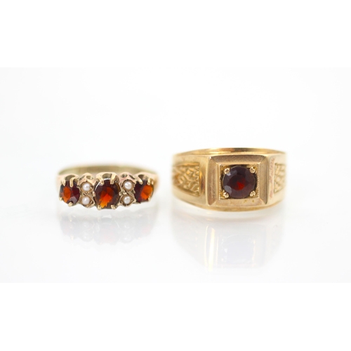 186 - A late 19th century garnet and seed pearl ring, the three graduated oval cut garnets with two seed p... 