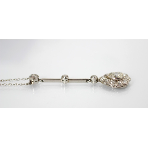 198 - An early 20th century pear cut diamond pendant, the central pear cut diamond within surround of ten ... 