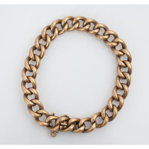 203 - A yellow metal curb link bracelet, the hollow links with tongue and box fastening, stamped ‘9c’ 17.5... 