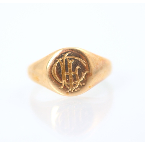 204 - An 18ct rose gold signet ring, the circular head with engraved monogram to centre, stamped to interi... 