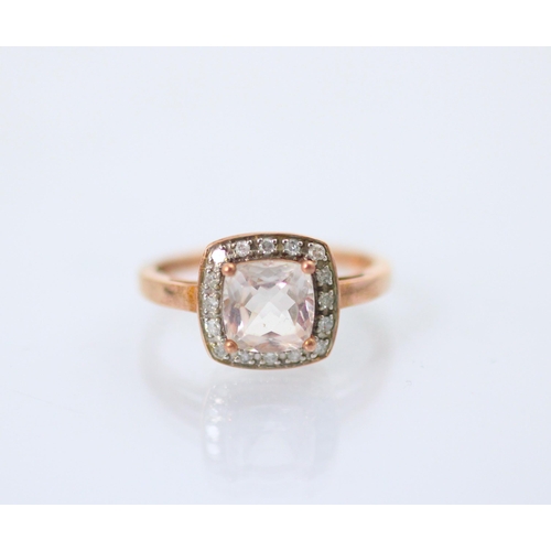 208 - A 9ct untested morganite and diamond cluster ring, the fancy cut pink stone within surround of sixte... 