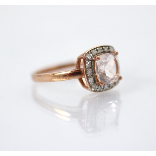 208 - A 9ct untested morganite and diamond cluster ring, the fancy cut pink stone within surround of sixte... 