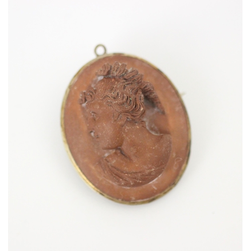 210 - An early 20th century lava cameo, the oval cameo carved depicting lady facing dexter, within base me... 