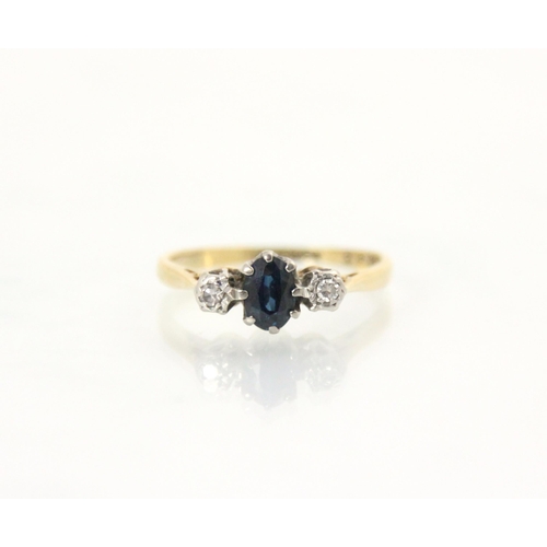 212A - An Edwardian style untested sapphire and diamond three stone ring, the central oval cut blue stone w... 