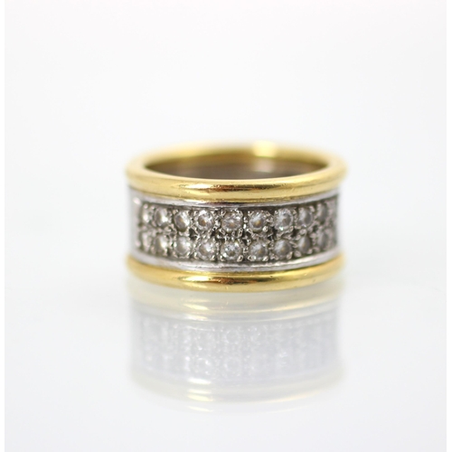 222 - An 18ct two tone diamond set ring, the white and yellow gold band ring set with double row of twenty... 