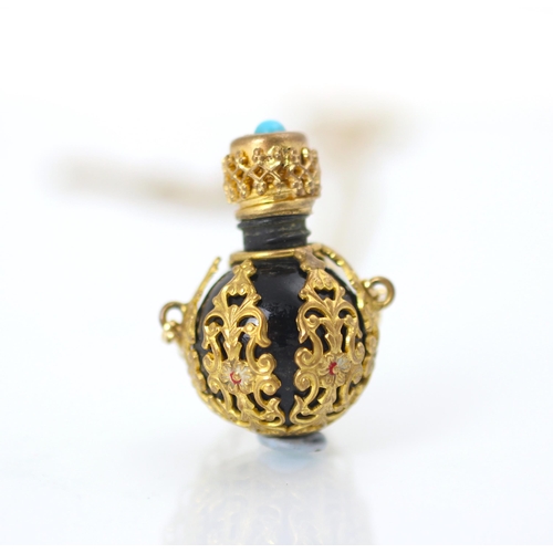 226 - An early 20th century perfume pendant, the globular shaped vinaigrette with overlay scroll decoratio... 