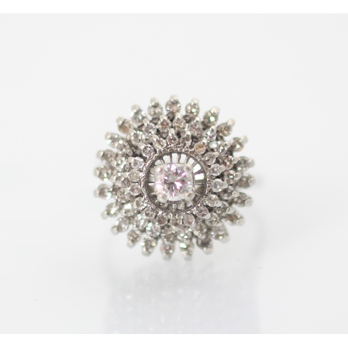 232 - A 1960’s diamond set dress ring, the central round cut diamond within triple raised borders set with... 