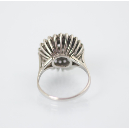 232 - A 1960’s diamond set dress ring, the central round cut diamond within triple raised borders set with... 