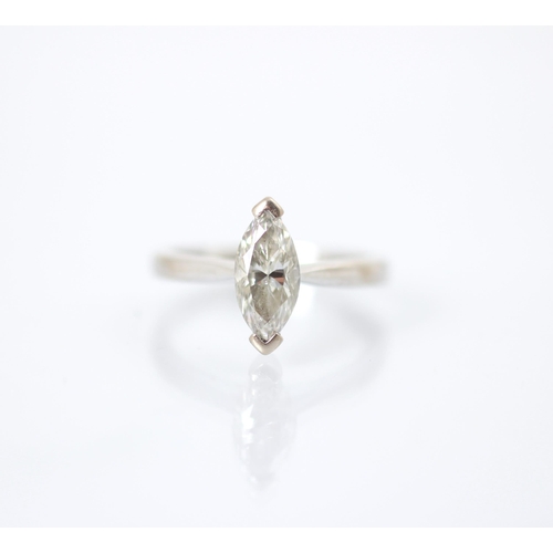 238 - A certified marquise cut diamond solitaire, the diamond set with rubover setting to each terminal of... 