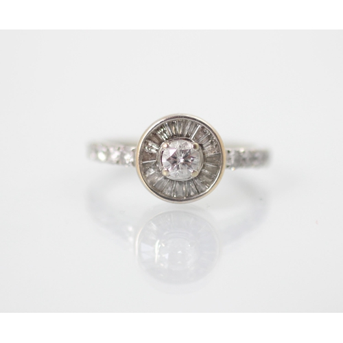 242 - A diamond stylised target ring, the central round cut diamond with fancy cut diamonds radiating out ... 