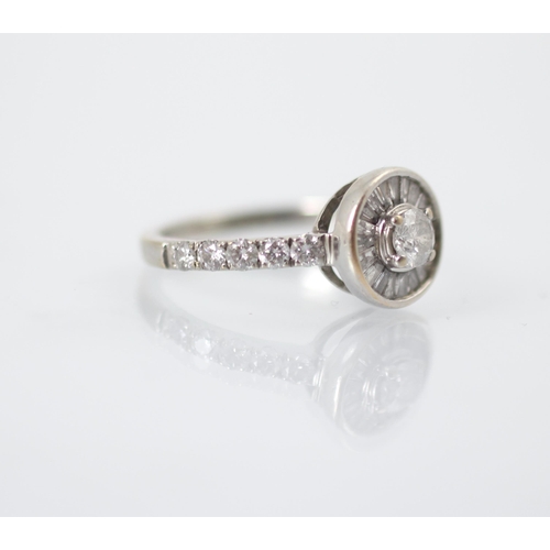 242 - A diamond stylised target ring, the central round cut diamond with fancy cut diamonds radiating out ... 