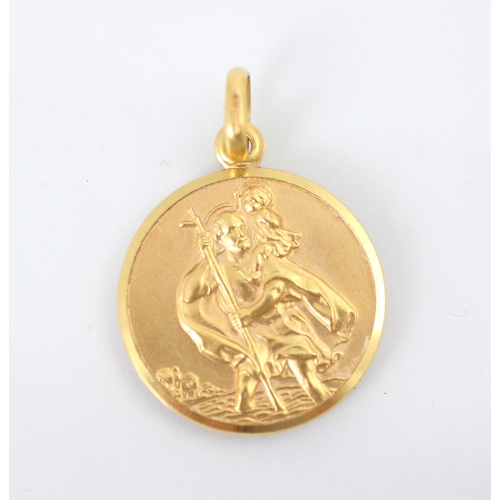 245 - A yellow metal pendant, the circular pendant with St Christopher detail to the front, stamped '375' ... 