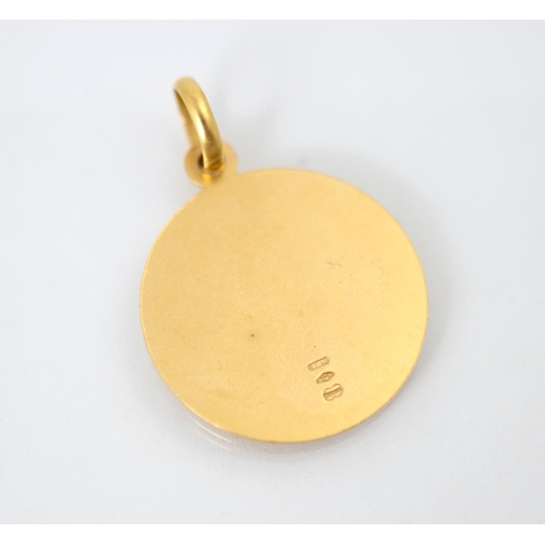 245 - A yellow metal pendant, the circular pendant with St Christopher detail to the front, stamped '375' ... 