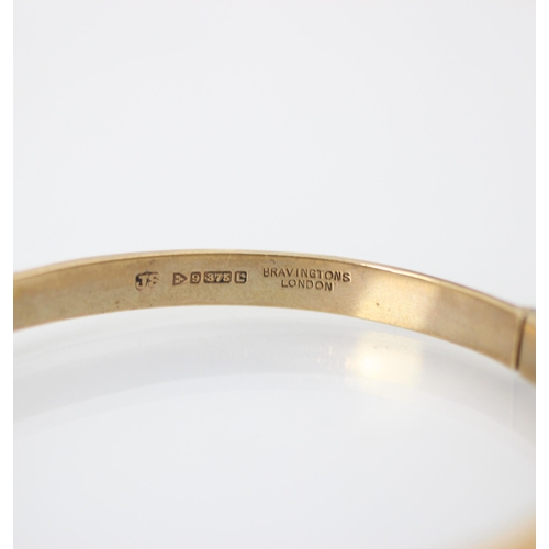 248 - A 9ct yellow gold bangle, the hollow bangle with engraved detail to exterior, stamped ‘JS’ Chester 1... 