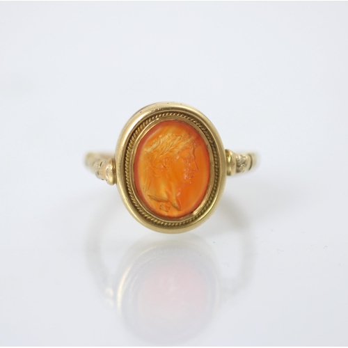 253 - An 18th century intaglio ring, the oval intaglio depicting a Roman Emperor, in profile, facing dexte... 