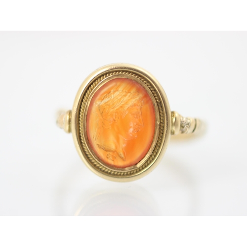 253 - An 18th century intaglio ring, the oval intaglio depicting a Roman Emperor, in profile, facing dexte... 