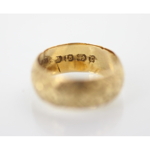 262 - A Victorian 18ct yellow gold ring, with continuous floral engraved detail, stamped indistinctly, Bir... 