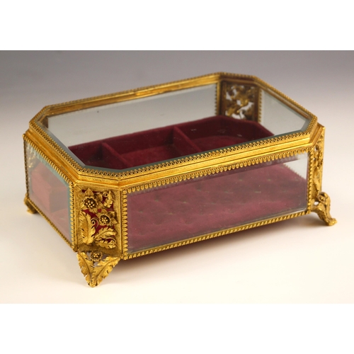 279 - An ormolu filigree jewellery casket, 20th century, of rectangular form with canted corners, with bev... 