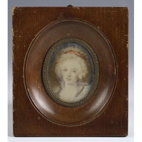 332 - English school (19th century),  
An oval portrait miniature depicting a young lady with red hairband... 