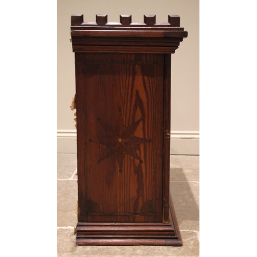 806 - A Victorian Gothic revival pitch pine wall shelf in the Puginesque manner, the castellated cornice o... 