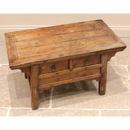 816 - A Chinese elm Kang type coffee table, early 20th century, the cleated oversailing plank top above tw... 