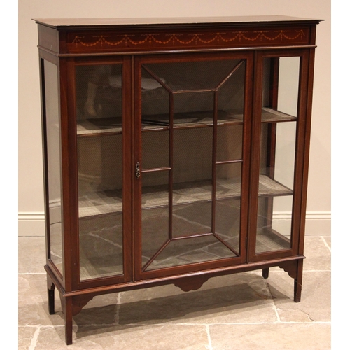 828 - An Edwardian mahogany display cabinet, the frieze inlaid with boxwood harebell swags over a single a... 