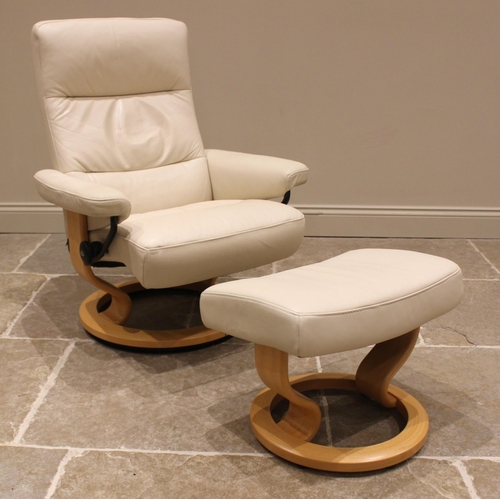 831 - An Ekornes Stressless cream leather armchair, late 20th/early 21st century, with a reclining and swi... 