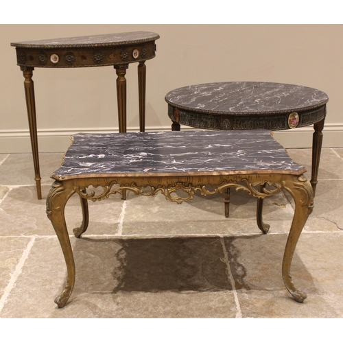 835 - A gilt metal and simulated marble coffee table, mid 20th century, the serpentine shaped top over a r... 