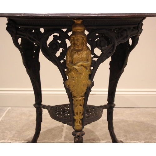 882 - A Victorian cast iron Britannia pub table, the oval hardwood top upon three supports cast with a fig... 