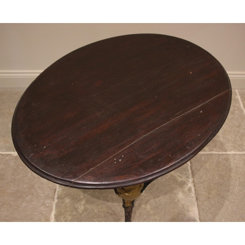 882 - A Victorian cast iron Britannia pub table, the oval hardwood top upon three supports cast with a fig... 