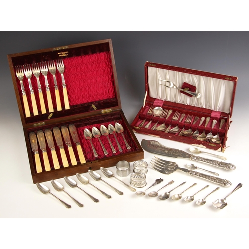 104 - A six place silver plated fish service, the engraved blades and tines with bone handles within Walke... 