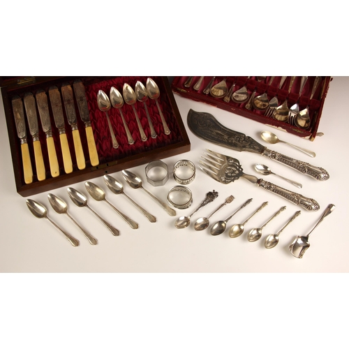 104 - A six place silver plated fish service, the engraved blades and tines with bone handles within Walke... 