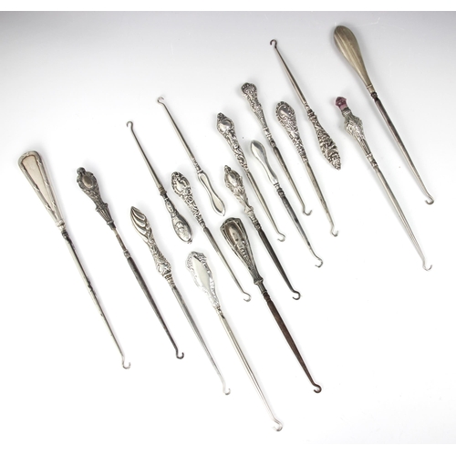 61 - A selection of silver and silver plate mounted button hooks, including an example by Adie & Lovekin ... 