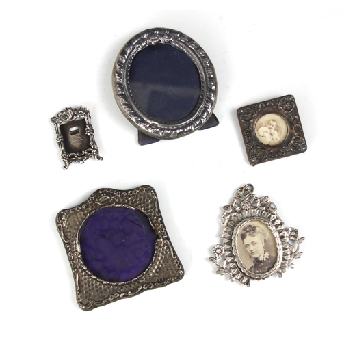 64 - A selection of five silver and white metal photograph frames, to include a David Richards & Sons, Lo... 