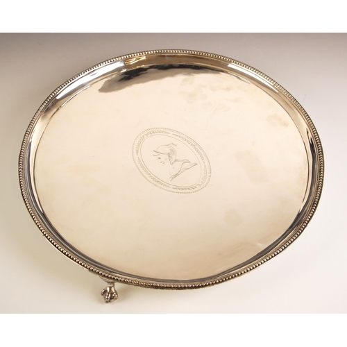 68 - A George III silver salver, Elizabeth Jones, London 1782, the beaded rim enclosing oval cartouche, u... 