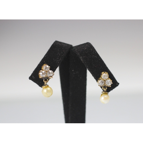 131 - A pair of diamond and cultured pearl earrings, the three old cut diamonds in a trefoil design suspen... 