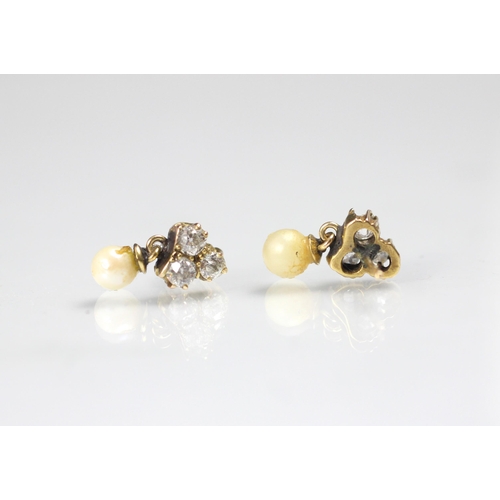 131 - A pair of diamond and cultured pearl earrings, the three old cut diamonds in a trefoil design suspen... 