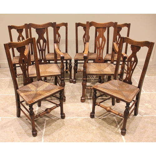 809 - A set of eight ash splat back country chairs, late 19th/early 20th century, each with a pierced vase... 