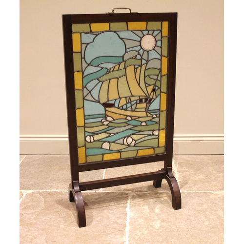 829 - An Arts & Crafts leaded and coloured glass fire screen, depicting a galleon in full sail, within a p... 