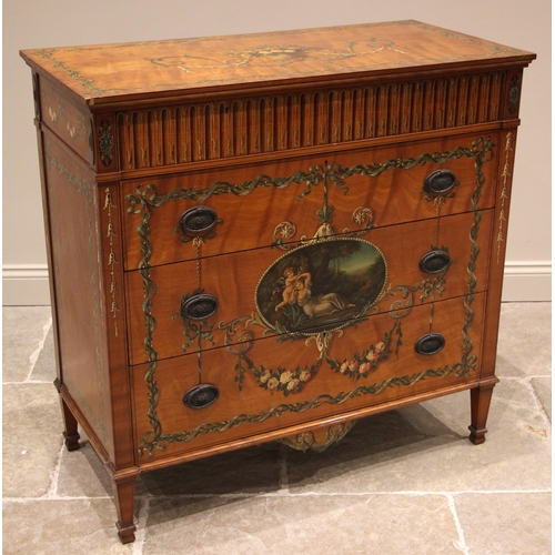 815 - A Sheraton revival satinwood chest of drawers, early 20th century, the rectangular top centred with ... 