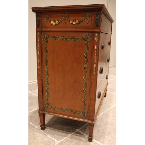 815 - A Sheraton revival satinwood chest of drawers, early 20th century, the rectangular top centred with ... 