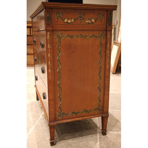 815 - A Sheraton revival satinwood chest of drawers, early 20th century, the rectangular top centred with ... 