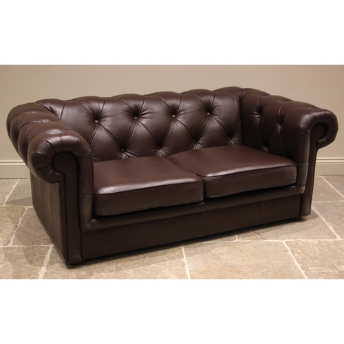 856 - A nut brown leather Chesterfield sofa, late 20th/early 21st century, of typical deep seated form, th... 