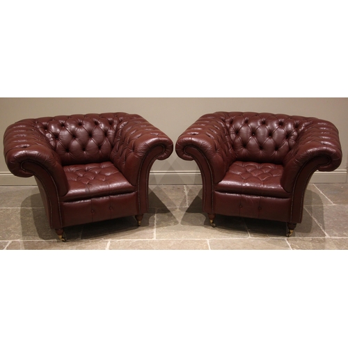 857 - A pair of Chesterfield red leather tub chairs, late 20th/early 21st century, each of deep seated for... 