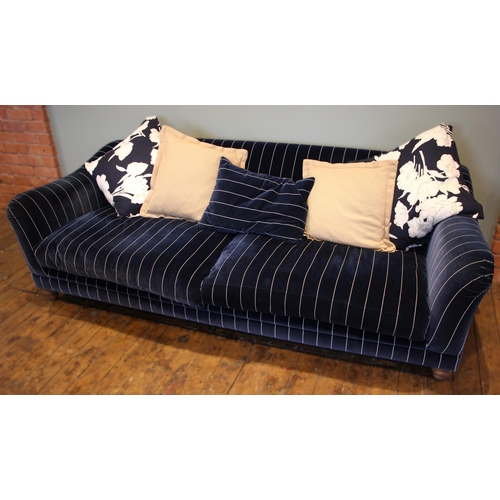 861 - A Tetrad 'Gatsby' sofa in Ralph Lauren striped blue fabric, upon turned hardwood legs, with five ass... 