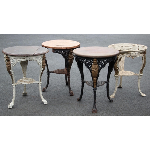 880 - Four cast iron Britannia pub tables, each with a circular hardwood top upon relief cast supports (4)... 